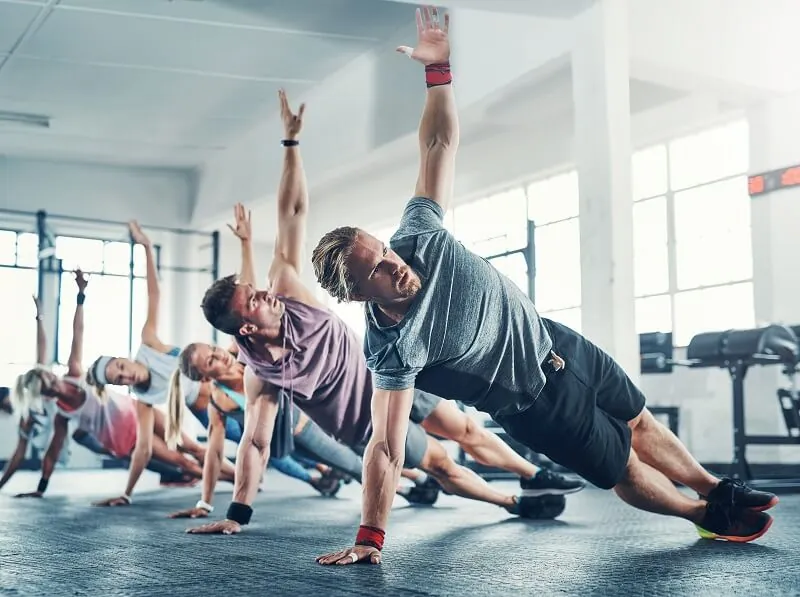 Group fitness class performing stretches.