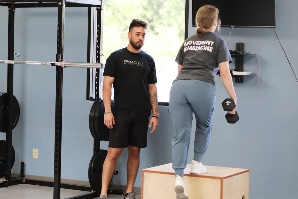 Trainer helping with exercises.
