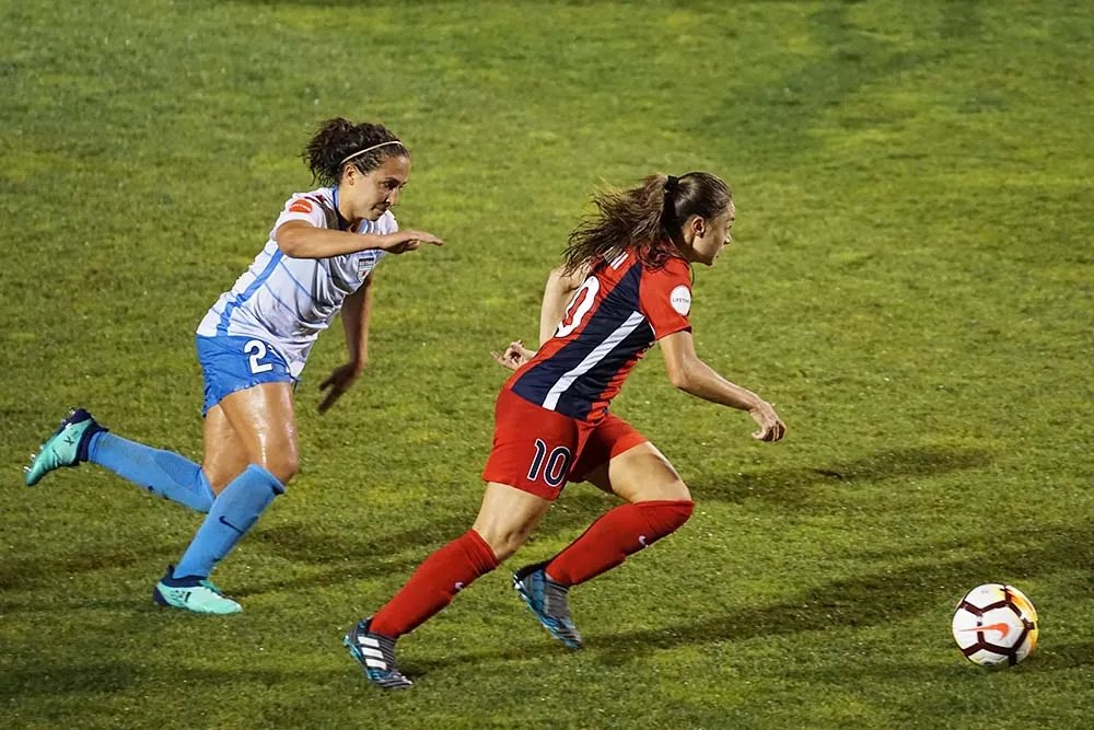 Women playing soccer.