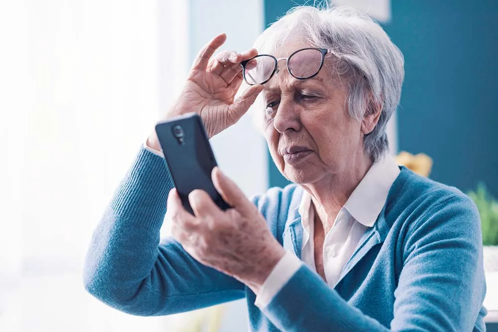 Elder woman struggling to see.