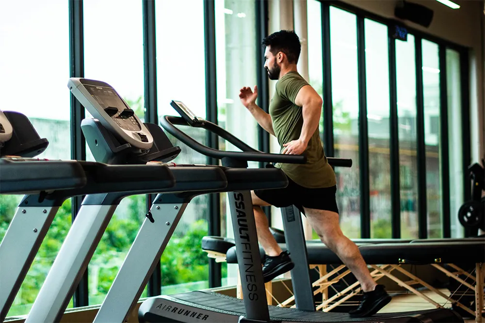 Man running on treadmill.