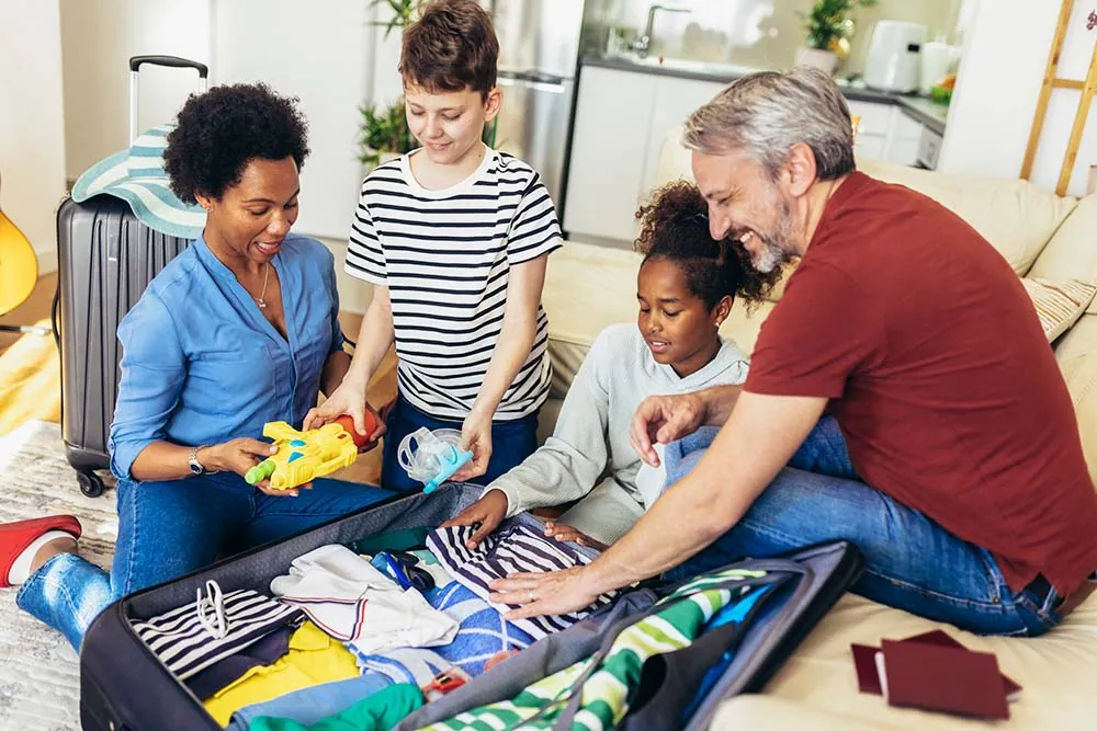 Family packing suitcase.