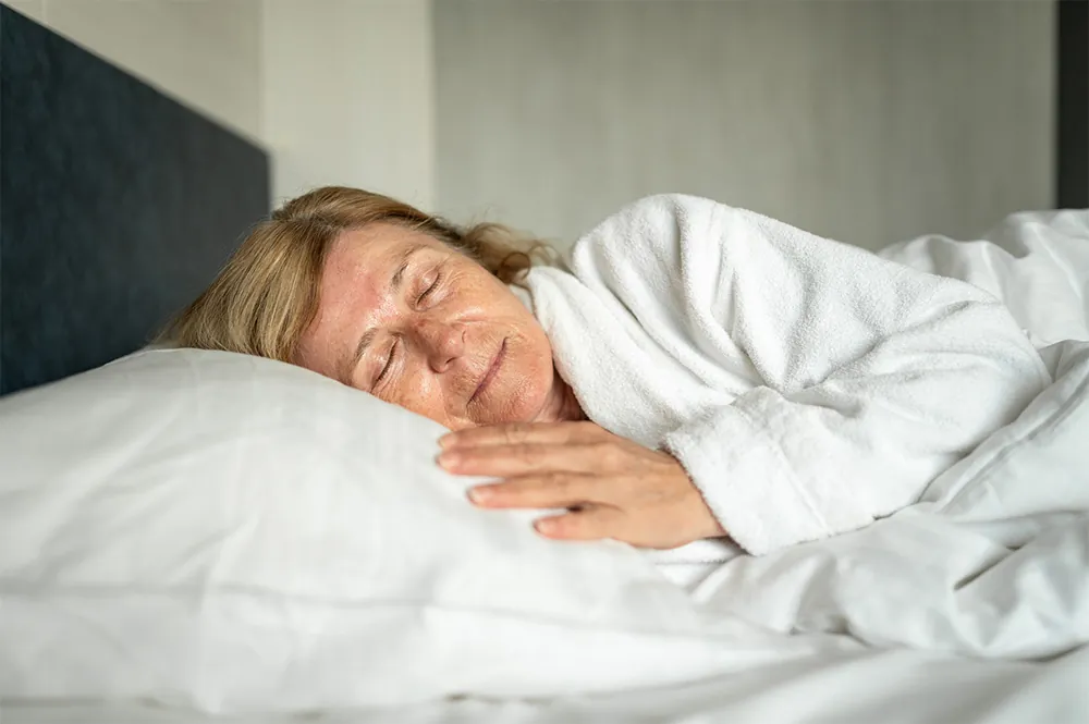 Woman sleeping on side position.
