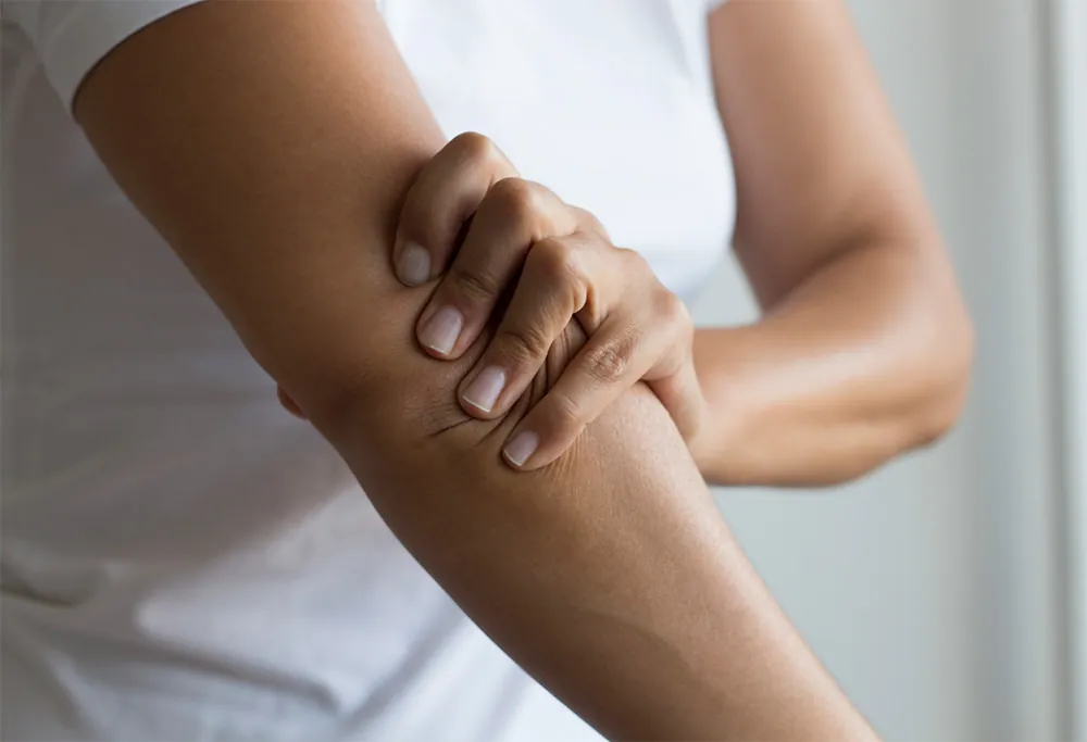 Woman suffering from joint pain.