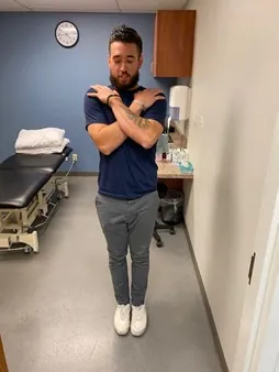 Physical therapist demonstrating a vestibular exercise.