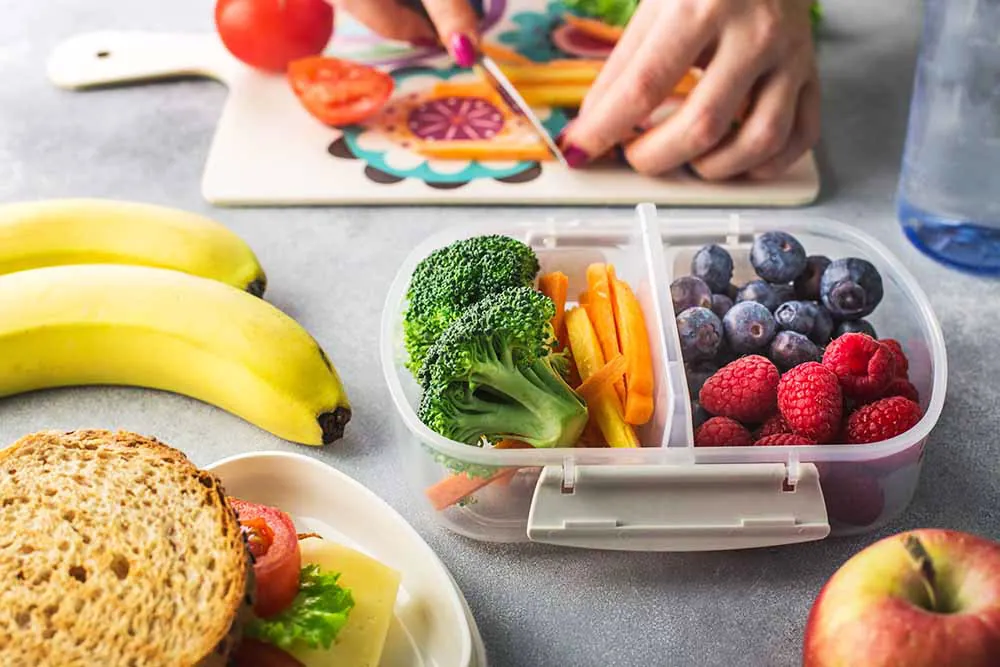 Woman packing healthy snacks.