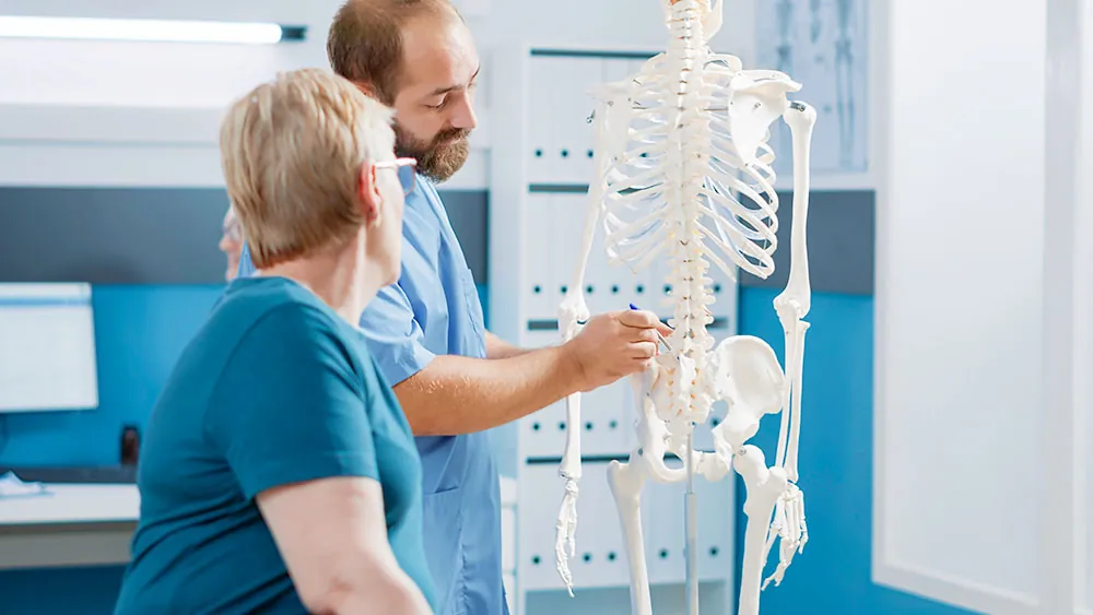 Doctor is discussing the cause of the patient's pain.