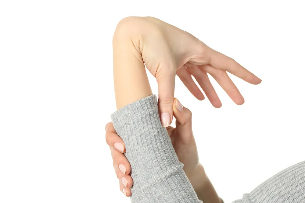 Woman's flexible hands indicating Hypermobility Syndrome.