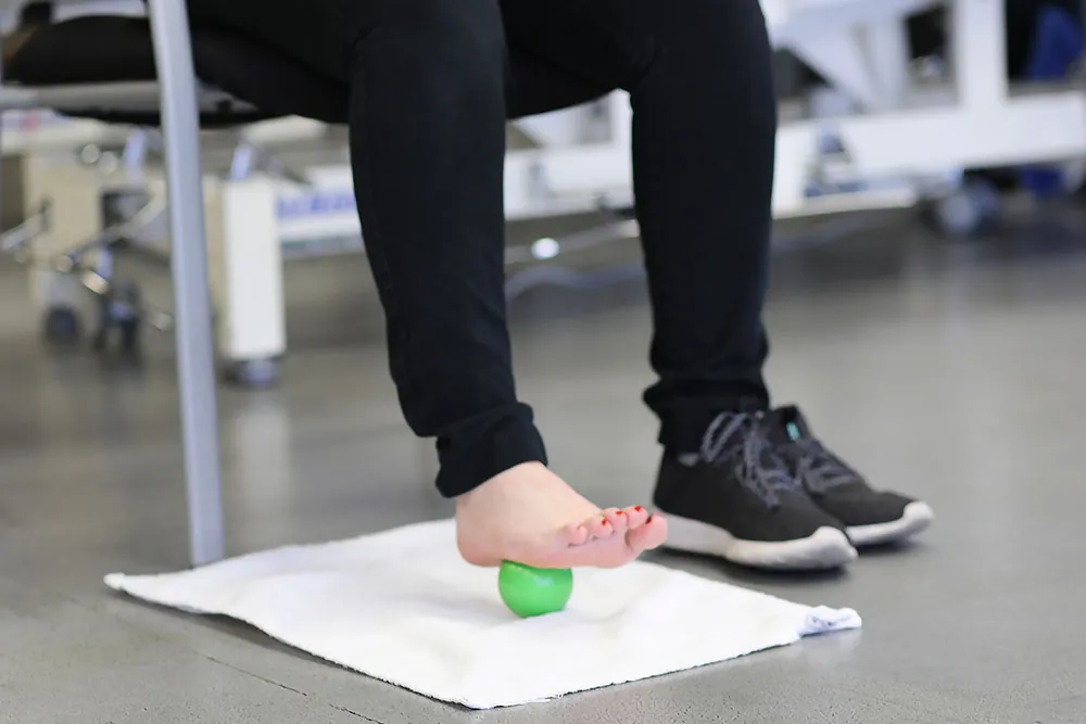 Foot exercise treating plantar fasciitis.